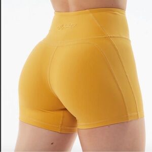 Alphalete Pulse Surge Bike Shorts Exotic Mustard Yellow Booty